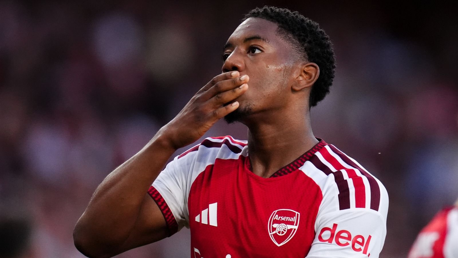 Arsenal's Myles Lewis-Skelly celebrates after scoring against Como